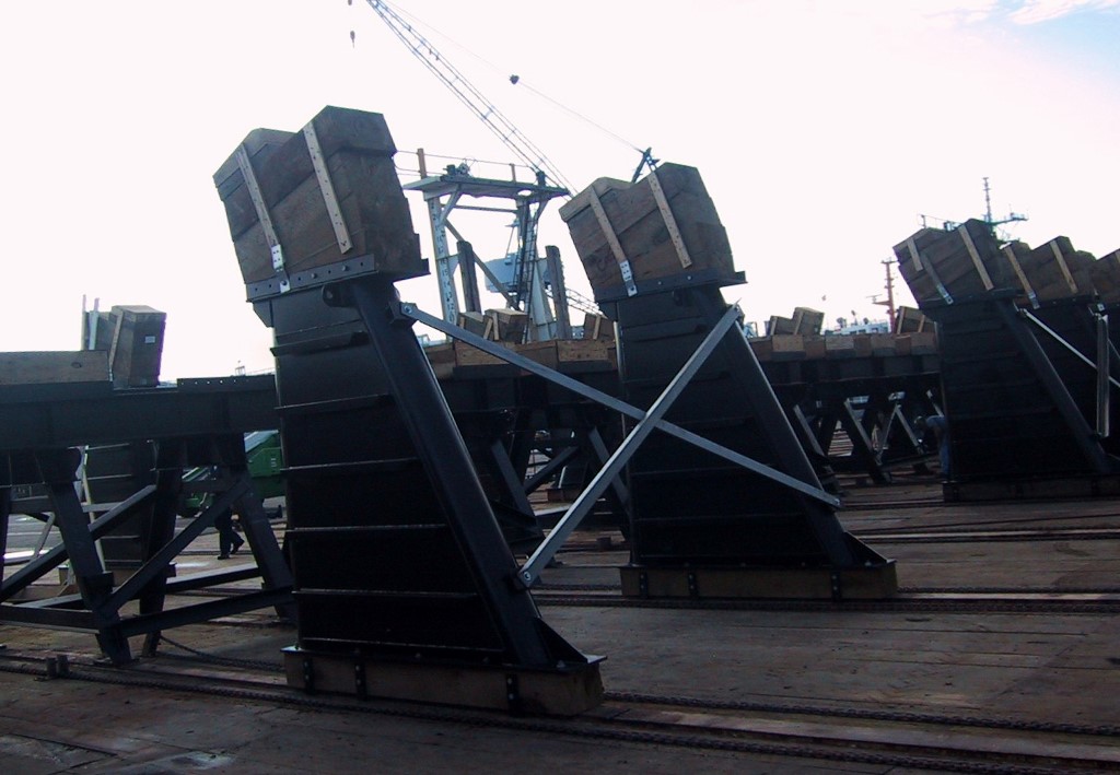 Hauling blocks in position for docking of US Navy frigate