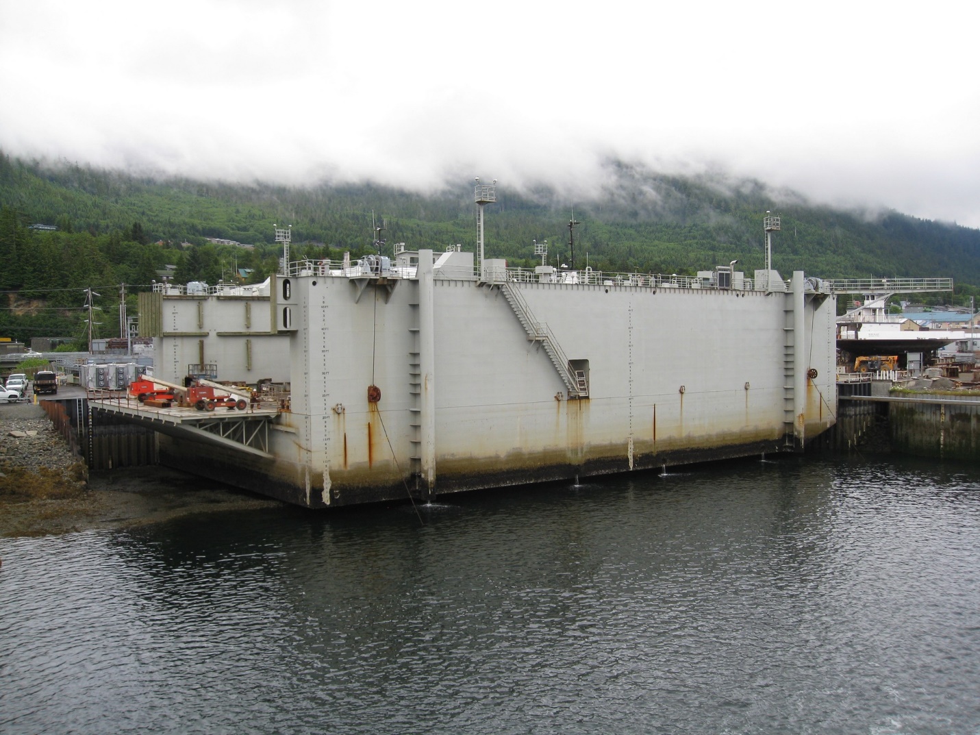 Alaska 36000 long ton floating transfer dock shown landed on grid at low tide